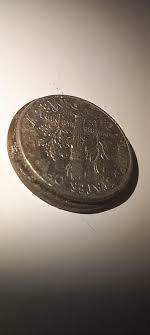 Found this coin(s?) They're fused together, are they worth ...