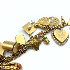 Sold at Auction: 14K GOLD CHARM BRACELET. HEAVY VINTAGE ...