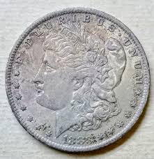 1883 O Morgan Silver Dollar • .900 Silver • Nice Toning • AU