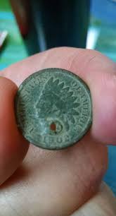 Many people wonder why coins were holed and often believe ...