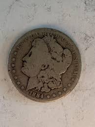 Sold at Auction: 1884 Morgan Silver Dollar