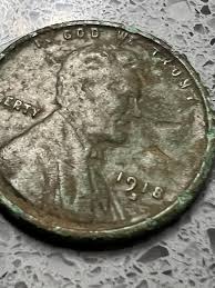 Found this 1918 S Wheaty today. Weird marks on it? : r/metaldetecting