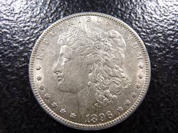 Sold at Auction: **AU** 1896-O Morgan Silver Dollar