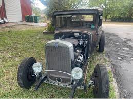 1931 Chevy 5 window. Original uncut body 355ci w/Holley aluminum heads, summit racing 750 carb Camaro T5 trans w/s10 tail. Fully boxed frame. Drop crossmember, drilled split wishbones 4” drop axle, Vega
