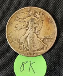 Sold at Auction: 1942 Toned US Silver Walking Liberty Half Dollar Coin