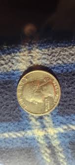 How to differentiate between mint and post-mint damage on coins?