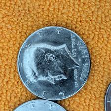 Misc half dollars 1 of them is an error coins. No initials ...