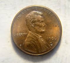 1986 D penny with double-stamped 'D' and white holes