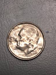 Is this mottled dime a post-mint damage or an error coin?