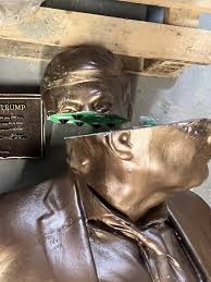 Statue of Trump holding hands with Epstein pulled from ...