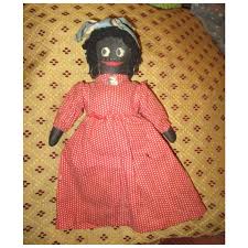 Adorable black cloth doll. For Sale at Ruby Lane
