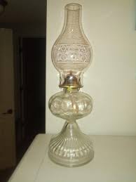 Does anyone know the age of this oil lamp? My Grandmother (80) said was her Mother's or Grandmother's lamp and the chimney was replaced. : r/Antiques