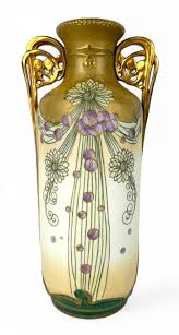 Sold at Auction: ART NOUVEAU ART POTTERY VASE ATTRIBUTED TO HELIOSINE Organic form with molded poppy flower design and iridescent glaze. Unmarked. He...