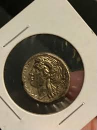 Identify old coin with gold loop charm