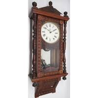 Ansonia Clock Co., 'Regulator A' 8 day walnut drop dial wall clock, brass bezel enclosing signed 11