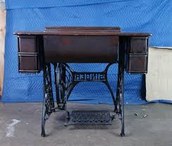 Antique 1919 Singer Red Eye Cast Iron Treadle Sewing Machine Model 66 and Cabinet at 1stDibs | 1919 singer sewing machine value, singer model 66 cabinet, draw and label a treadle sewing machine