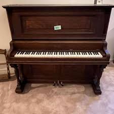Oak piano Harrington Brand | EstateSales.org