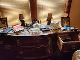 How to declutter and organize a messy workspace?