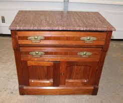 Sold at Auction: Antique Victorian walnut Tennessee Brown marble top 2 drawer 2 door washstand