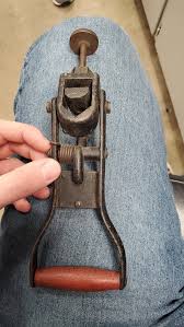 Bought this old cast iron tool at a yard sale. Adjustable and has teeth on it like it's a puller of some sort. No one has any clue what it is. Any