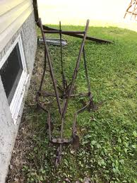 Antique plow Horse Drawn Walk Behind Cultivator/Plow, Steel Handles, 5 Steel Points Length: Hook to handle 5' 8” Widest Width: Blade edge to edge 3' Antique horse-drawn cultivator, used as rustic metal