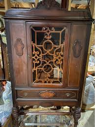 Antique china hutch. Missing small piece of curly-q wood but was purchased like that by my grandfather. $150 OBO. 68”T x 36.5”W x 14.5”D. All measurements approximate. Very heavy, bring help. Local