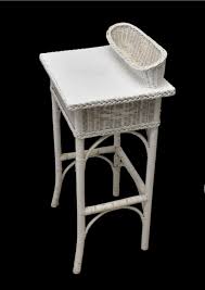 Sold at Auction: 2 Vintage wicker pieces - console with center drawer, lower shelf and glass top Sold with small telephone table