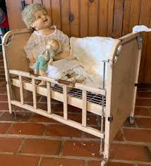 LOT:55G: Effanbee Lovums Antique Composite Doll w/Cloths Vintage Crib & Smaller Doll | EstateSales.org
