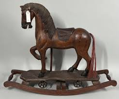 Lot - Hand carved wooden rocking horse with attached leather ...