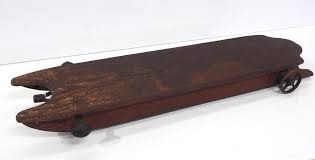 Sold at Auction: Child size road sled with wheels & steering