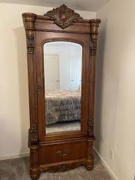 Sold at Auction: 2491, LARGE LIGHT MAHOGANY WARDROBE - PULASKI FURNITURE