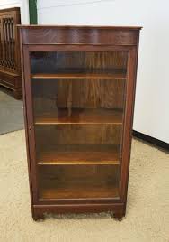 Sold at Auction: OAK ONE DOOR CURIO CABINET