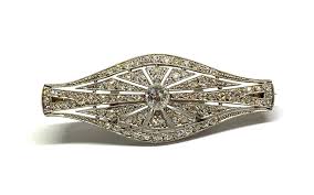 Sold at Auction: An Art Deco Platinum Diamond Brooch/Pendant