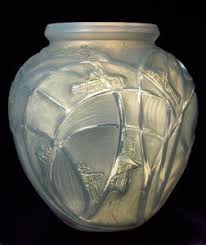 Coquilles, an opalescent glass vase moulded with overlying ...
