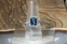 Blue Topaz Ring with Diamond Halo and Accents - Larc Jewelers