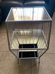 two metal and glass nightstands