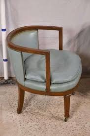 Pair of blue leather curved back open arm chairs with ...