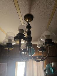 Who can replace lighting fixtures in bathroom and kitchen?