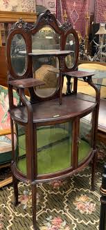 Sold at Auction: Antique Mahogany Etagere with Curved Glass.