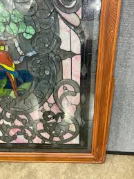 Sold at Auction: LARGE SELF FRAMED STAINED/ LEADED GLASS WINDOW WITH PARROT PICTORAL SCENE MULTI COLOR
