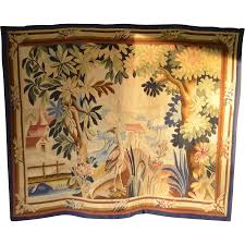 A Belgian hand woven tapestry panel depicting an exotic bird ...