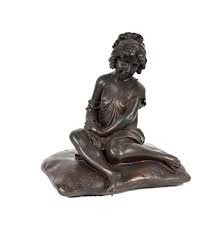 Lot - A French Bronze Figure of a Girl on a Pillow