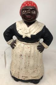 Lot - Vintage Black Americana door stop of a mammy with ...
