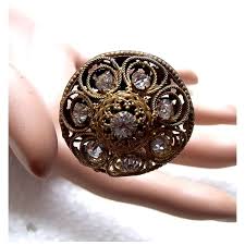 Matched pair late Edwardian hatpins fancy metal filigree rhinestone . For Sale at Ruby Lane