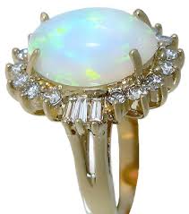14k-y gold Oval Ethiopian opal, with round and Tapered ...