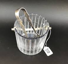 Sold at Auction: Baccarat Crystal Ice Bucket with silver plated tongs. Ht. 8 3/4"