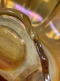 9" Round Crimped marigold carnival glass bowl with small ...