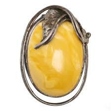 Sold at Auction: Russian Egg Yolk Amber and Sterling Silver Brooch