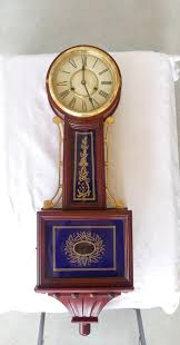 Sold at Auction: Large Mahogany Banjo Clock with Blue & Gold Painted Glass, With Pendulum