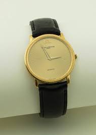 Lot - 18K YELLOW GOLD BAUME & MERCIER STRAP WATCH